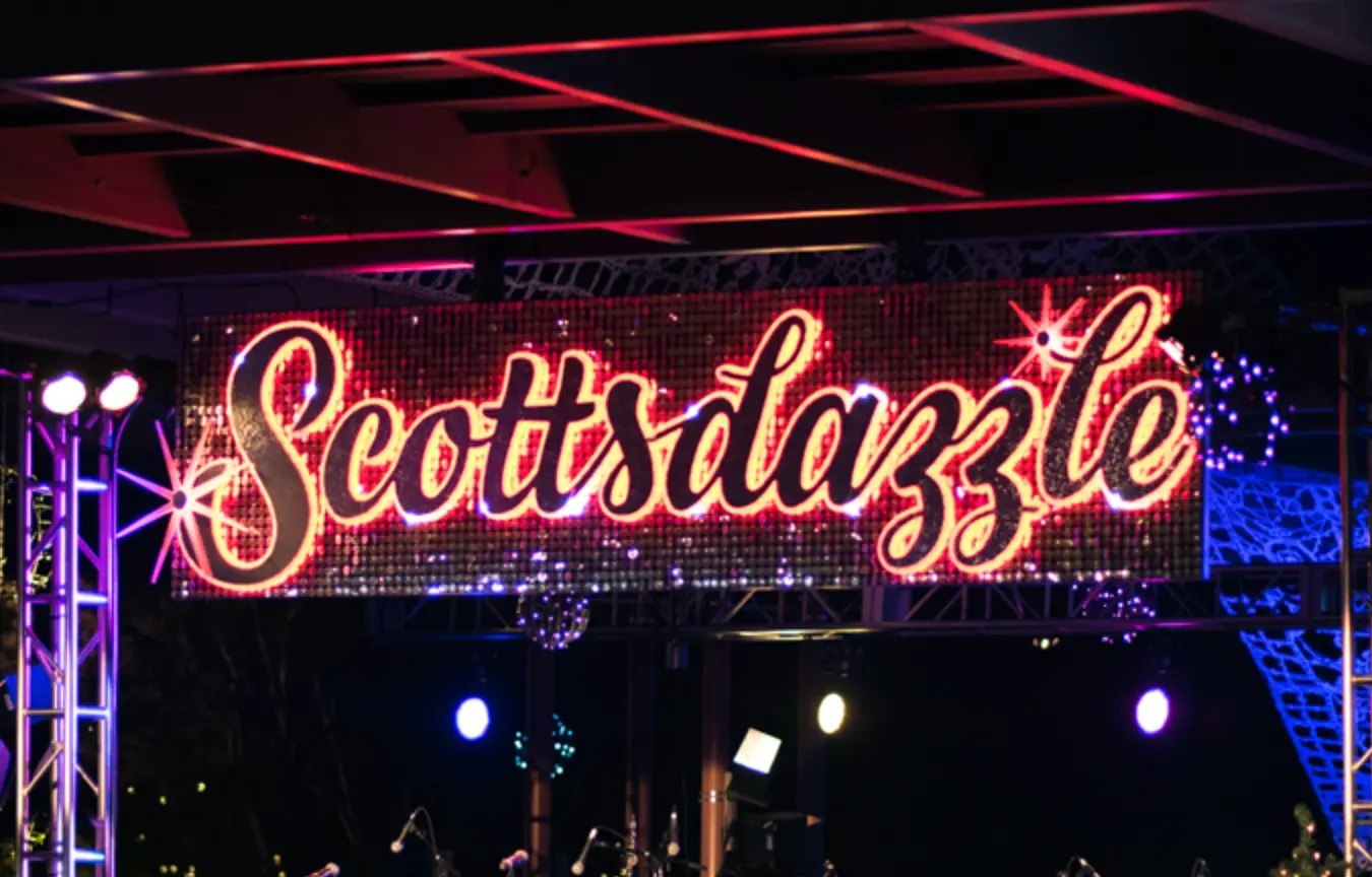 "Scottsdazzle" logo, dark with warm hue back-lighting